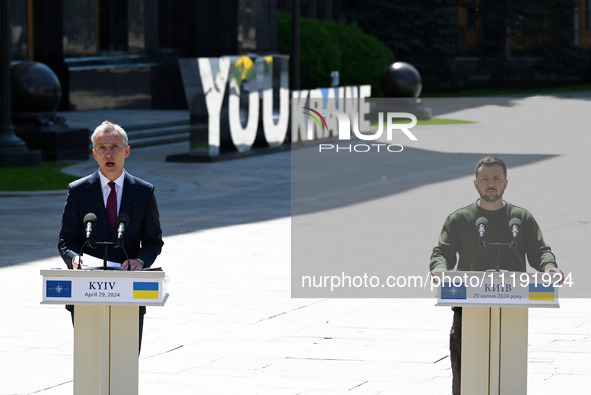 NATO Secretary General Jens Stoltenberg (L) and President of Ukraine Volodymyr Zelensky (R) take part at a press conference following their...