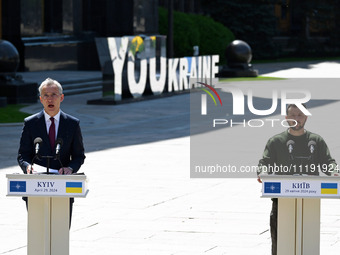 NATO Secretary General Jens Stoltenberg (L) and President of Ukraine Volodymyr Zelensky (R) take part at a press conference following their...