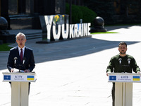 NATO Secretary General Jens Stoltenberg (L) and President of Ukraine Volodymyr Zelensky (R) take part at a press conference following their...