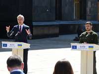 NATO Secretary General Jens Stoltenberg (L) and President of Ukraine Volodymyr Zelensky (R) are participating in a press conference followin...