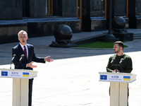 NATO Secretary General Jens Stoltenberg (L) and President of Ukraine Volodymyr Zelensky (R) take part at a press conference following their...