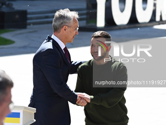 NATO Secretary General Jens Stoltenberg (L) and President of Ukraine Volodymyr Zelensky (R) shake hands after at a press conference followin...