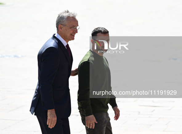 NATO Secretary General Jens Stoltenberg (L) and President of Ukraine Volodymyr Zelensky (R) leave a press conference following their negotia...