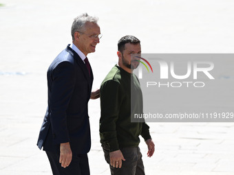 NATO Secretary General Jens Stoltenberg (L) and President of Ukraine Volodymyr Zelensky (R) leave a press conference following their negotia...