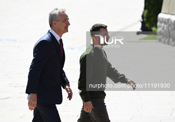 NATO Secretary General Jens Stoltenberg (L) and President of Ukraine Volodymyr Zelensky (R) are leaving a press conference following their n...