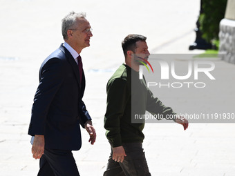 NATO Secretary General Jens Stoltenberg (L) and President of Ukraine Volodymyr Zelensky (R) are leaving a press conference following their n...