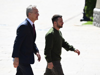 NATO Secretary General Jens Stoltenberg (L) and President of Ukraine Volodymyr Zelensky (R) are leaving a press conference following their n...