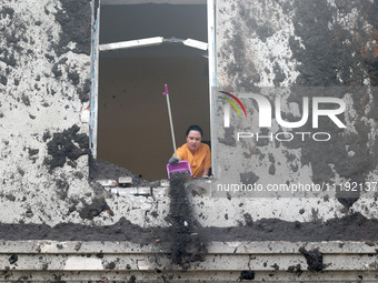 KHARKIV, UKRAINE - APRIL 27, 2024 - A woman removes soil from a windowsill at Psychiatric Hospital N3 in the Saltivskyi district following a...