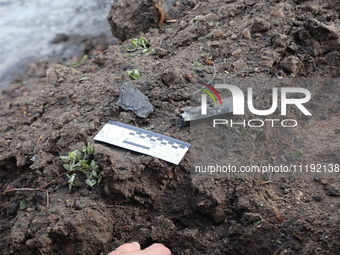 KHARKIV, UKRAINE - APRIL 27, 2024 - A photomacrographic scale lies on the ground at Psychiatric Hospital N3 in the Saltivskyi district follo...