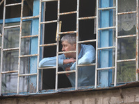 KHARKIV, UKRAINE - APRIL 27, 2024 - A man looks out of a grated window at Psychiatric Hospital N3 in the Saltivskyi district following a nig...