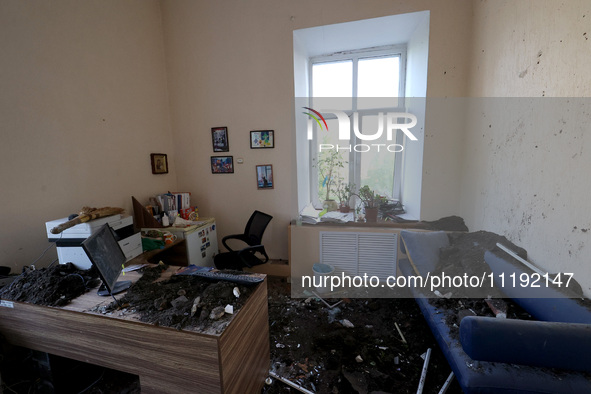 KHARKIV, UKRAINE - APRIL 27, 2024 - Soil and debris carpet the floor of a room at Psychiatric Hospital N3 in the Saltivskyi district followi...