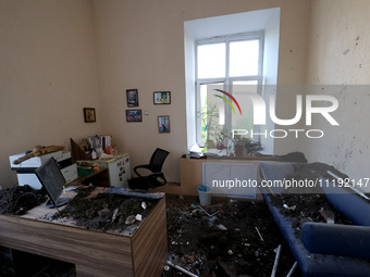 KHARKIV, UKRAINE - APRIL 27, 2024 - Soil and debris carpet the floor of a room at Psychiatric Hospital N3 in the Saltivskyi district followi...