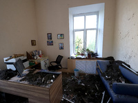 KHARKIV, UKRAINE - APRIL 27, 2024 - Soil and debris carpet the floor of a room at Psychiatric Hospital N3 in the Saltivskyi district followi...