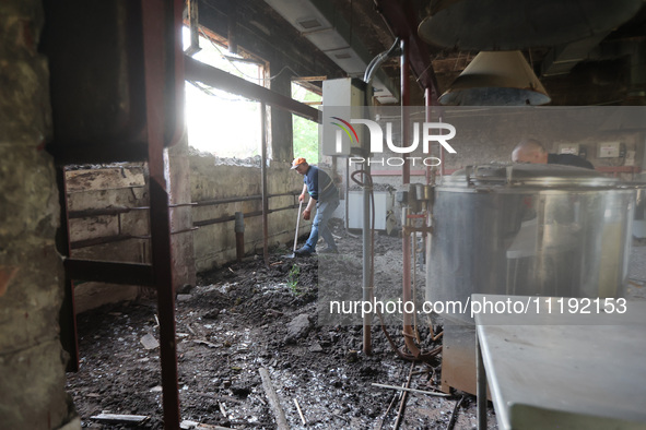 KHARKIV, UKRAINE - APRIL 27, 2024 - A man removes the soil from the food block at Psychiatric Hospital N3 in the Saltivskyi district followi...