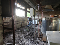 KHARKIV, UKRAINE - APRIL 27, 2024 - A man removes the soil from the food block at Psychiatric Hospital N3 in the Saltivskyi district followi...