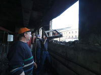 KHARKIV, UKRAINE - APRIL 27, 2024 - Men clean the premises of Psychiatric Hospital N3 in the Saltivskyi district following a nighttime Russi...