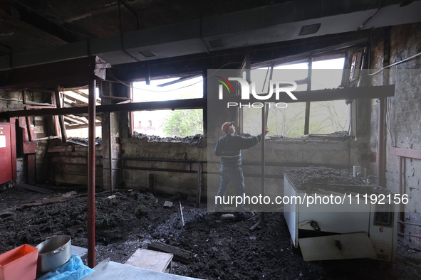 KHARKIV, UKRAINE - APRIL 27, 2024 - A man cleans the premises of Psychiatric Hospital N3 in the Saltivskyi district following a nighttime Ru...