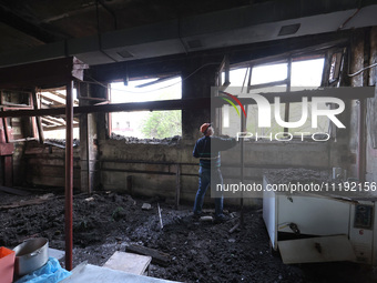 KHARKIV, UKRAINE - APRIL 27, 2024 - A man cleans the premises of Psychiatric Hospital N3 in the Saltivskyi district following a nighttime Ru...