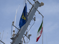 An Iranian flag and a flag of the Islamic Revolutionary Guard Corps (IRGC) are hanging on a warship as it participates in the IRGC marine pa...