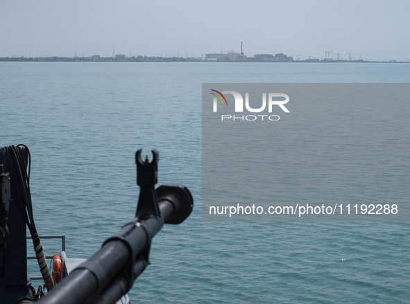 A general view of the Bushehr nuclear power plant is being seen from an Islamic Revolutionary Guard Corps (IRGC) Navy warship during the IRG...