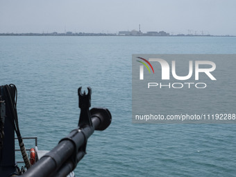 A general view of the Bushehr nuclear power plant is being seen from an Islamic Revolutionary Guard Corps (IRGC) Navy warship during the IRG...