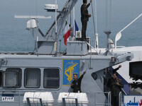 Islamic Revolutionary Guard Corps (IRGC) Navy military personnel are standing on a warship during the IRGC marine parade commemorating the P...