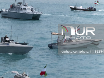 Two Islamic Revolutionary Guard Corps (IRGC) Navy warships and Basij paramilitary force speed boats are participating in the IRGC marine par...