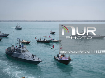 Islamic Revolutionary Guard Corps (IRGC) Navy warships and Basij paramilitary force speed boats are sailing along the Persian Gulf during th...