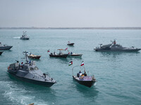 Islamic Revolutionary Guard Corps (IRGC) Navy warships and Basij paramilitary force speed boats are sailing along the Persian Gulf during th...