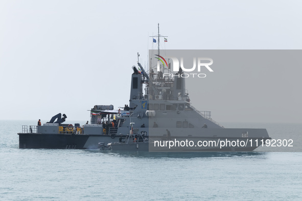 An Islamic Revolutionary Guard Corps (IRGC) Navy warship is sailing along the Persian Gulf during the IRGC marine parade, which is commemora...