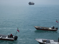 Basij paramilitary force speed boats are participating in a marine parade to commemorate Persian Gulf National Day, near the Bushehr nuclear...