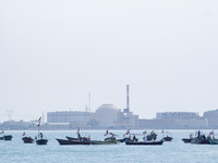 Basij paramilitary force speed boats are sailing along the Persian Gulf near the Bushehr nuclear power plant during the IRGC marine parade t...