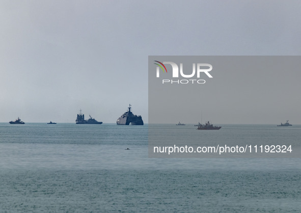 Islamic Revolutionary Guard Corps (IRGC) Navy warships are sailing along the Persian Gulf during the IRGC marine parade to commemorate Persi...