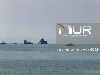 Islamic Revolutionary Guard Corps (IRGC) Navy warships are sailing along the Persian Gulf during the IRGC marine parade to commemorate Persi...