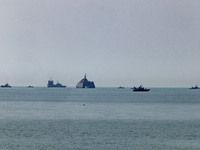 Islamic Revolutionary Guard Corps (IRGC) Navy warships are sailing along the Persian Gulf during the IRGC marine parade to commemorate Persi...