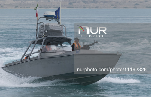 An Islamic Revolutionary Guard Corps (IRGC) speed boat is sailing along the Persian Gulf during the IRGC marine parade to commemorate the Pe...