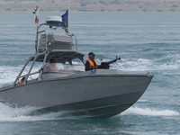 An Islamic Revolutionary Guard Corps (IRGC) speed boat is sailing along the Persian Gulf during the IRGC marine parade to commemorate the Pe...