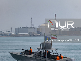 An Islamic Revolutionary Guard Corps (IRGC) speed boat is sailing along the Persian Gulf during the IRGC marine parade, which is commemorati...