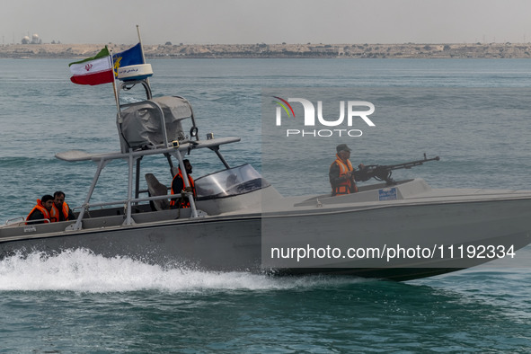 An Islamic Revolutionary Guard Corps (IRGC) speed boat is sailing along the Persian Gulf during the IRGC marine parade to commemorate Persia...