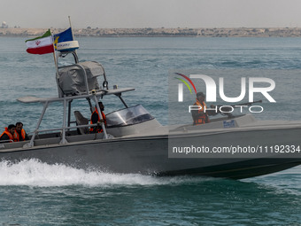 An Islamic Revolutionary Guard Corps (IRGC) speed boat is sailing along the Persian Gulf during the IRGC marine parade to commemorate Persia...