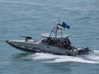 An Islamic Revolutionary Guard Corps (IRGC) speed boat is sailing along the Persian Gulf during the IRGC marine parade to commemorate Persia...