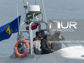 An Islamic Revolutionary Guard Corps (IRGC) speed boat is sailing along the Persian Gulf during the IRGC marine parade, which is commemorati...