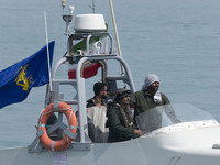 An Islamic Revolutionary Guard Corps (IRGC) speed boat is sailing along the Persian Gulf during the IRGC marine parade, which is commemorati...