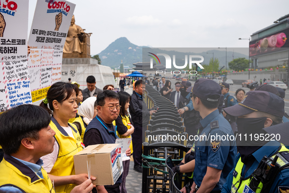 Service Union members are facing police obstruction outside the U.S. Embassy in Seoul, South Korea, on April 30, 2024, as they attempt to de...