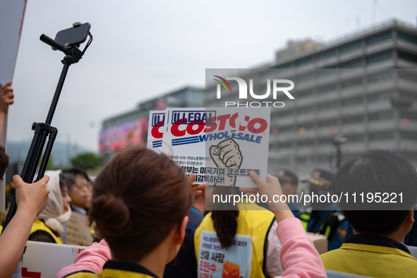 Service Union members are facing police obstruction outside the U.S. Embassy in Seoul, South Korea, on April 30, 2024, as they attempt to de...