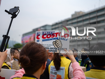 Service Union members are facing police obstruction outside the U.S. Embassy in Seoul, South Korea, on April 30, 2024, as they attempt to de...