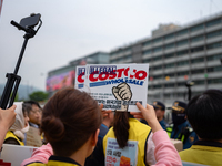 Service Union members are facing police obstruction outside the U.S. Embassy in Seoul, South Korea, on April 30, 2024, as they attempt to de...