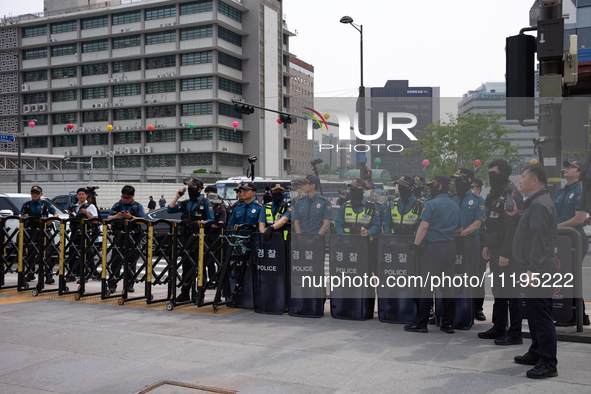 Police are blocking Service Union members from approaching the U.S. Embassy in Seoul, South Korea, on April 30, 2024, preventing their plann...