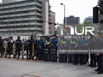 Police are blocking Service Union members from approaching the U.S. Embassy in Seoul, South Korea, on April 30, 2024, preventing their plann...