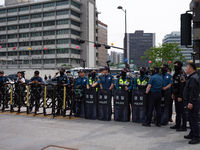 Police are blocking Service Union members from approaching the U.S. Embassy in Seoul, South Korea, on April 30, 2024, preventing their plann...